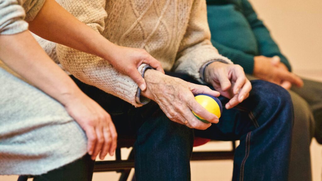Older couple enjoying a walk outdoors with support